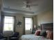 Serene main bedroom features neutral tones, tray ceiling, natural light and ample space at 933 Brutus Ter, Lake Mary, FL 32746