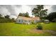 Inviting single story home with manicured lawn, charming gazebo and lush, mature trees at 10672 Sw 75Th Ter, Ocala, FL 34476