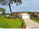 Beautiful single-story home with well maintained lawn, mailbox, and inviting front entrance at 10672 Sw 75Th Ter, Ocala, FL 34476