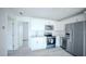 Beautifully renovated kitchen featuring stainless steel appliances and stylish white cabinetry at 10672 Sw 75Th Ter, Ocala, FL 34476