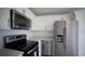 New kitchen with stainless steel appliances and white cabinets at 10672 Sw 75Th Ter, Ocala, FL 34476