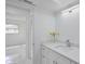 Bathroom with a modern vanity and sleek fixtures, next to a door leading to another room at 2310 Laguna Dr, Indian Lake Estates, FL 33855