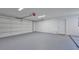 Spacious garage with a clean, minimalist design and ample room for storage at 2310 Laguna Dr, Indian Lake Estates, FL 33855