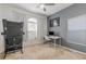 A bedroom featuring a large window, modern desk, office chair, and carpeted flooring at 339 Magical Way, Kissimmee, FL 34744