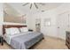 Spacious bedroom with ceiling fan, serene wall art, and neutral carpeting at 339 Magical Way, Kissimmee, FL 34744