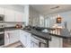 Modern kitchen with stainless steel appliances, breakfast bar, and ample counter space at 339 Magical Way, Kissimmee, FL 34744
