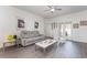 Comfortable living room features laminate floors, modern decor, and neutral color palette at 339 Magical Way, Kissimmee, FL 34744