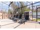 Covered pool area with lounge chairs and storage shed at 339 Magical Way, Kissimmee, FL 34744