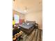 Comfortable bedroom with a large window, fan, and contemporary furniture at 5685 Lake Victoria Dr, Lakeland, FL 33813