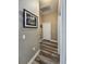 Neutral hallway featuring modern flooring, stylish wall decor, and multiple doorways at 5685 Lake Victoria Dr, Lakeland, FL 33813