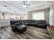 Comfortable living room with a sectional couch, wood-look floors, and recessed lighting at 5685 Lake Victoria Dr, Lakeland, FL 33813