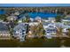 Aerial view of waterfront homes on a lake with boat docks at 616 Peninsular Dr, Lakeland, FL 33813