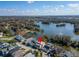 Beautiful aerial view of a waterfront home featuring mature trees, lush lawns, and gorgeous lake views at 616 Peninsular Dr, Lakeland, FL 33813
