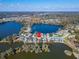 Stunning aerial view of lakefront home featuring lush greenery, lake views, and gorgeous landscaping at 616 Peninsular Dr, Lakeland, FL 33813