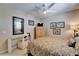 Comfortable bedroom featuring a ceiling fan, accent furniture and neutral colors at 616 Peninsular Dr, Lakeland, FL 33813