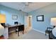 Well-lit bedroom featuring a fan, a large desk, and modern decor at 616 Peninsular Dr, Lakeland, FL 33813