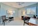 Well-lit bedroom featuring a fan, a large desk, and modern decor at 616 Peninsular Dr, Lakeland, FL 33813