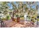 Outdoor deck with chairs and table overlooking the water at 616 Peninsular Dr, Lakeland, FL 33813
