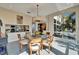 Elegant dining room with round glass table, wood chairs, and large windows at 616 Peninsular Dr, Lakeland, FL 33813