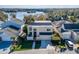 Exterior shot of house with well-maintained landscaping, two-car garage and neutral paint at 616 Peninsular Dr, Lakeland, FL 33813