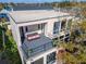 Aerial view of a house with a flat roof, balcony with outdoor seating at 616 Peninsular Dr, Lakeland, FL 33813