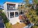 Two-story home with balconies, large windows, and waterfront views at 616 Peninsular Dr, Lakeland, FL 33813
