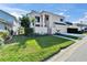 Modern two-story home with manicured lawn and tropical landscaping at 616 Peninsular Dr, Lakeland, FL 33813