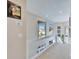 Bright hallway with large windows offering scenic views, recessed lighting, and neutral decor at 616 Peninsular Dr, Lakeland, FL 33813