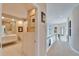 Upstairs hallway with view into bathroom, offering a glimpse of the well-lit space and design at 616 Peninsular Dr, Lakeland, FL 33813