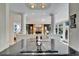Modern kitchen featuring a cooktop island with columns and a view of the backyard at 616 Peninsular Dr, Lakeland, FL 33813
