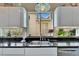 Modern kitchen features a stainless steel sink, sleek countertops, white cabinets and natural lighting at 616 Peninsular Dr, Lakeland, FL 33813