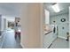 Hallway view of a laundry room equipped with washer, dryer, sink, and cabinetry at 616 Peninsular Dr, Lakeland, FL 33813