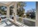 Living room with large picture windows showcasing stunning water views and natural light at 616 Peninsular Dr, Lakeland, FL 33813