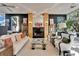 Bright living room with a fireplace, comfortable seating, and ample natural light at 616 Peninsular Dr, Lakeland, FL 33813