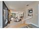 Bright living room with a fireplace, columns, neutral paint, and many windows overlooking the backyard at 616 Peninsular Dr, Lakeland, FL 33813