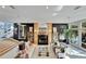 Open living space with fireplace and comfortable seating and staircase access at 616 Peninsular Dr, Lakeland, FL 33813