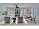 Bright, modern living room with plantation shutters, neutral decor, and large windows to let in natural light at 616 Peninsular Dr, Lakeland, FL 33813