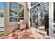 Outdoor patio with stainless steel grill, brick flooring, and glass doors at 616 Peninsular Dr, Lakeland, FL 33813
