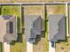Birds eye view of neighboring single Gathering homes each featuring a private backyard and driveway at 456 Hilltop Dr, Lake Wales, FL 33853