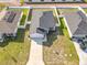Aerial view of home with driveway, fenced yard, and roof at 456 Hilltop Dr, Lake Wales, FL 33853