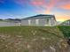 Home exterior with screened patio and spacious fenced backyard at 456 Hilltop Dr, Lake Wales, FL 33853