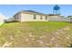 Home exterior featuring fenced backyard with grass at 456 Hilltop Dr, Lake Wales, FL 33853