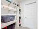 Functional laundry area with built-in shelves, counter, and storage at 456 Hilltop Dr, Lake Wales, FL 33853