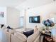 Comfortable living room with a sectional couch, television, and decorative accents at 456 Hilltop Dr, Lake Wales, FL 33853