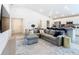 Spacious living room with view of the open floor plan and vaulted ceiling at 456 Hilltop Dr, Lake Wales, FL 33853