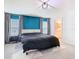 The main bedroom features an accent wall, carpet floors, and ensuite bathroom at 456 Hilltop Dr, Lake Wales, FL 33853