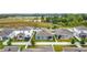 Aerial view of fenced backyard with patio and trampoline with a well-maintained lawn at 648 Bloom Ter, Davenport, FL 33836