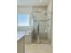 Well-lit bathroom boasts a separate tiled shower and tub, providing spa-like relaxation at 648 Bloom Ter, Davenport, FL 33836