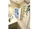 Bathroom featuring double sink vanity, tiled floors, and a shower with curtain at 648 Bloom Ter, Davenport, FL 33836