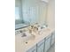 Bathroom with double sinks and quartz countertops at 648 Bloom Ter, Davenport, FL 33836